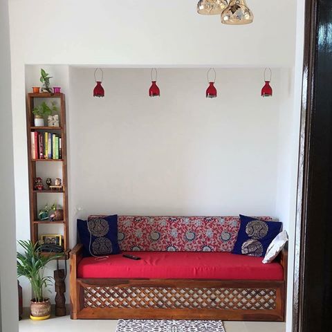 White Walls, splashes of color everywhere. Just the way to do it! .
#Repost @anuradhaanks (@get_repost)
・・・
Hey guys small living room decor with sofa cum bed & cute book shelf , customised this from Jodhpur furniture vendor it took loads of patience for me to get this so perfect. My happy living room entry for #simplehomewelove
#mydesiswag #simplehomestyle #homedecor #mygreentreasure #candlesglamour #decorraga #brightspaceswelove #livingroomdecor #interiordesign #fintitstyleit #thebrighthome #desi #myhome #myhomevibe #plants #decor #ethnicdecor #candlestand #apartmentdecor #theapartment #smalllivingroom #thefestivaltale #homesweethome #indiandecor