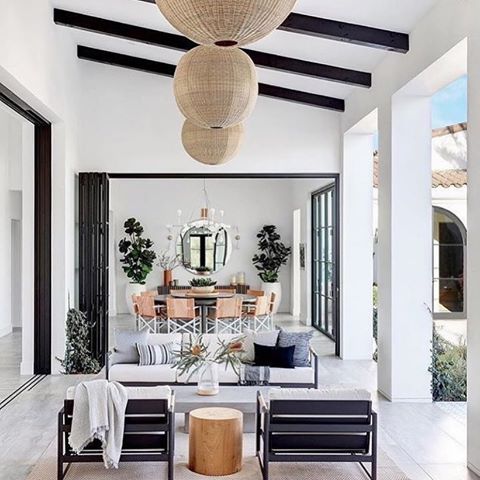 This indoor-outdoor space is what weekends are made of!! Who wouldn’t want some lounge time in this gorgeous space. I love how the indoor just flows out to this covered outdoor living area!!! Just dreamy!! #modernfarmhouse #coastalfarmhouse #farmhouse #farmhouseliving #modernspanish #interiordesign #hgtv #windows #farmhousestyle via @dream_casa
