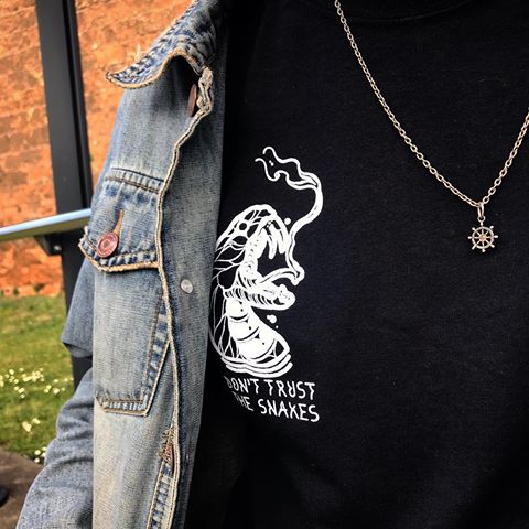 Don’t trust the Snakes! This is one of our newest products we have released as part of our ‘Eternal Rebel’ collection this month. This design is available on black and white tees and also crop tops. High quality material and prints. 30% off spring sale until this Sunday! Don’t miss out! .
.
www.thedevilsplayground-ltd.com
.
.
#clothing #clothingbrand #clothingline #streetwear #print #tattoo #tattoos #frontprint #tshirt #blackandwhite #style #streetstyle #tattooclothing #model #tshirt #croptop #fashion #photography #photoshoot  @_thedevilsplayground_