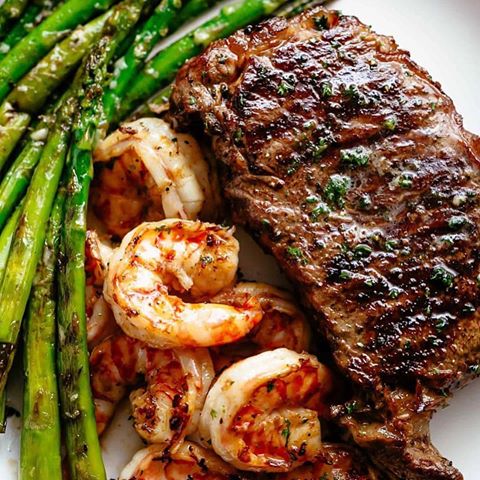 Also check @foodtipz .
.
Grilled Steak & Shrimp (SURF AND TURF) slathered in garlic butter makes for the BEST steak recipe! A gourmet steak dinner that tastes like something out of a restaurant, ready and on the table in less than 15 minutes. @cafedelites
.
Ingredients:
6 tablespoons unsalted butter, (divided)
4 cloves garlic, ((or 1 tablespoon minced garlic))
1 tablespoon fresh parsley, (chopped)
1 tablespoon olive oil
4 New York Steak strip steaks ((Porterhouse steaks))
Salt and pepper
8 ounces (250 g) shrimp (deveined, tails on or off)
——
Instructions:
Mix together butter, garlic and fresh chopped parsley. Refrigerate until ready to use.
Heat a large grill over high heat. Lightly grease grill plates with oil. Pat steaks dry with paper towel. Brush lightly with oil and generously season with salt and pepper.
Grill steaks for 4-5 minutes each side until browned and cooked to desired doneness. Spread half of the butter all over of steaks. Transfer steaks to a warm plate and let rest for 5 minutes.
While steaks are resting, melt remaining butter. Season shrimp with salt and pepper. 
Reduce heat to medium and grill your shrimp for 5-6 minutes, depending not the size and thickness of your shrimp. Flip each one halfway through cook time and continue cooking until they turn nice and pink in colour while white and opaque on the inside.
Toss remaining butter through shrimp and serve with steak!