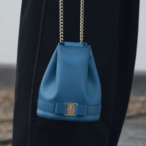 Add an elegant touch to casual day-chic with a Vara bow adorned bucket bag with tons of statement appeal #FerragamoPS19