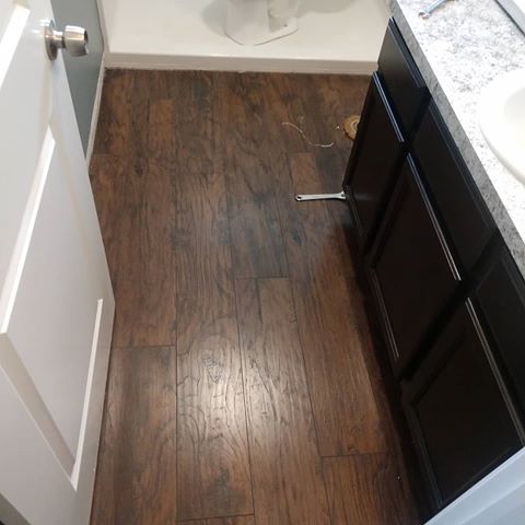 Out with the old and in with the new! 
Damaged #laminateflooring replaced with #woodgraintile. 
#scootershomesolutions 
#tilefloor #renovation #callme