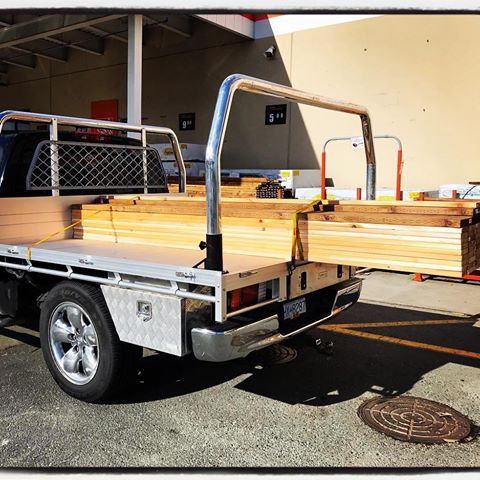 A load of 50 10ft cedar decking boards sitting happily on a 7’x7’ deck. #EasyLoad #TradeLite #Aluminum #Truck #FlatDeck #PickUp #Cedar #Decking #Builder #Contractor #TaxDeduction