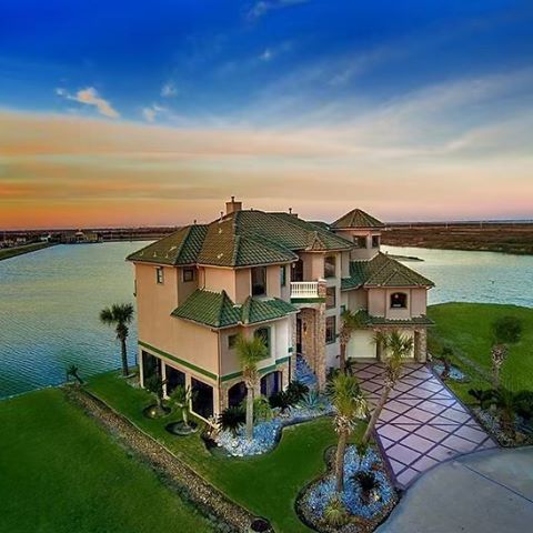A MUST SEE!! Waterfront Mediterranean style home in the gated community of Harborwalk!
28 Fleming, Galveston
3 Bedrooms. 4 Bathrooms. 3,715 SQFT.
One of the best views in the subdivision, and just 40 miles from Houston! Wraparound balconies, two staircases, security cameras inside and out, extensive tile flooring, abundant storage, two gas fireplaces, elevator, screened-in bottom floor and floor to ceiling windows provide tranquil water views throughout. Lighting, cameras, sprinklers and thermostats controlled from your smart phone. Superb fishing with underwater lighting, 20,000 lb boat lift, floating docks for jet ski and dinghy and deep water access to intercoastal waterway. Amenities include private yacht club with marina, swim center, restaurant and bar, ship store, bait shop, fuel and deli. Lots on either side of the home are also available for more privacy!
Call us today at 281-602-8823 to schedule a private tour.