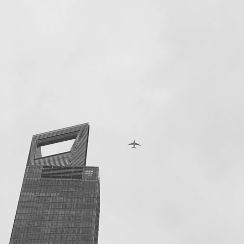 Shanghai world financial center #shanghaiworldfinancialcenter #открывашка #building #tall #thesecondtallest #blackandwhite #contemporary #airplane #art #architecture #sky #theskyisthelimit #shanghai #china #travel #cloudy #instatravel