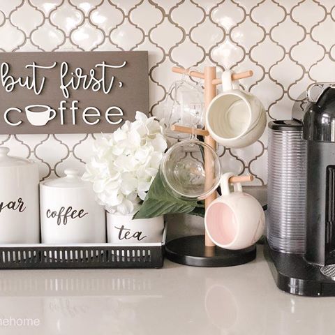 Happy Friday- Eve! 🙌🏽🌻
⠀⠀
So...I caught whatever the little one had 😫😫😫 but first..
⠀⠀
I’ve been trying to get the right mug holders for my little Coffee/Tea nook, however I’m not getting quite the look I want.
⠀⠀
I originally wanted a mug stand that would slide on to the cabinet above and the mugs would hang on the hooks so it takes up less counter space. However, our cabinets are too thick and my options were to get a mug stand like this pictured here orrrrr I have to screw the stand onto my cabinet. Yikes!
⠀⠀
Should I keep this or should I bite the bullet and screw it onto the cabinet?!? I really don’t know. 🤷🏽‍♀️
⠀⠀
Otherwise this little area is looking quite adorable with my favorite @oneone2design sign 😍
⠀⠀
Thoughts?!?!? Now that my rant is over 😂
⠀⠀
Mug stand- @amazon
Coffee Sign - @oneone2design 
Containers - @target
Container Tray - @target
Clear mugs- @amazon
Marble Mugs - @target
Nespresso Machine - @amazon
Arabesque Backsplash- Galaxy Tile
⠀⠀
#coffeenook #interiorstyling #pocketofmyhome #decor #chai #ipreview via @preview.app