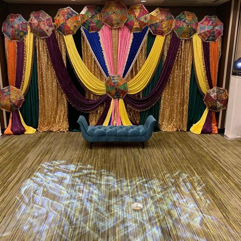 Mika’s ladies sangeet night decor setup.  We (#knkentertainmentgroup) had great pleasure of providing these services #dj #decorations #lighting #sound #backdrop #sofa #umbrellas #centerpieces #candles #candleholders #tablecloth #linen #jaago #buffettablecloth #movingheads #patternlights #truss #gobolights #strobelights