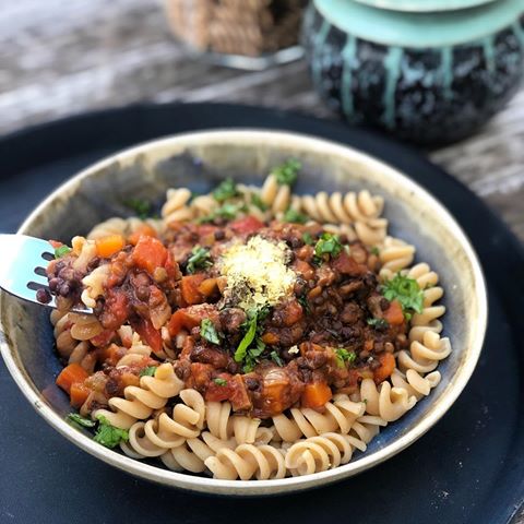 My lentil bolognese - super duper simple, minimal ingredients, nutrient dense and one for the whole family to enjoy. Perfect for meal prep too! I always make a big batch and then freeze into portions for the week. 
I use black beluga lentils (@bionaorganic tins) for ease (not sponsored just love 💕)
.
Just a half cup of cooked black lentils packs in about 12 grams of protein and 9 grams of fibre, a powerful nutrient combo that helps keep you full and energized.
.
Ingredients:
• 3 stalks of celery finely chopped
• 1 medium onion
• 1 large carrot
• 1tbsp olive oil
•  2 tins of lentils, rinsed and drained
• 1/2 cup dried porcini mushrooms (you can substitute for 10-12 chesnut mushrooms but flavour won’t be quite as rich or “meaty”)
• 1 carton or tin of chopped Italian tomatoes 🍅 • Vegan bouillon powder (can sub for a stock cube) • optional: rosemary, thyme, chilli - to add in after you have cooked off the onion, carrot and celery combo
.
Directions:
• Soak the dried porcini mushrooms in boiling water for 15 minutes
• whilst the mushrooms are soaking, Heat the olive oil gently and then add in the onion, carrot and celery and cook on medium heat until the onions are translucent - then add in optional seasoning - chilli, salt etc
• add in the rinsed and drained lentils • drain the mushrooms (the water from this is super flavourful so I always add a little splash throughout the cooking process and save some for soup) • Add in the bouillon powder and chopped tomatoes 🍅 • Simmer for 40 mins to 1 hour 
Serve with brown pasta, spaghetti or some steamed veg 🥦🥕 topped with nutritional yeast for a B12 hit and some fresh basil 🌿