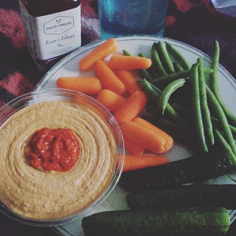 Simple yummy dinner-  carrots, green beans, cucumbers, hummus and a pressed juice